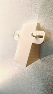 RC car wall mount installed on wall in garage / workshop